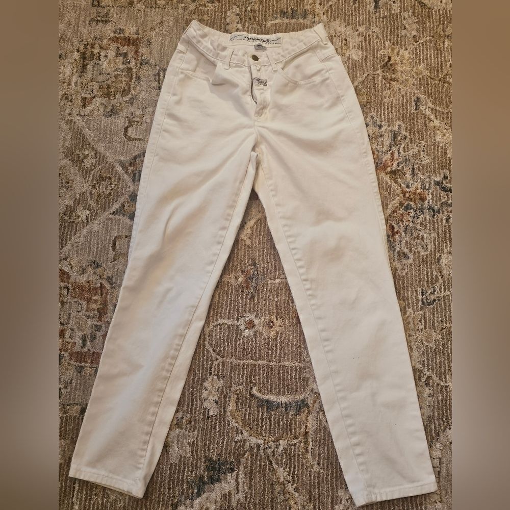 Girbaud jeans sz 7/8. Please see pics for tiny spots on bottom of legs